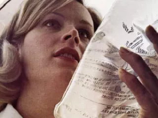 Nurse holding a Viaflex IV container